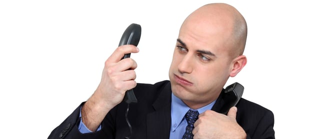 photodune-2643134-overwhelmed-businessman-answering-telephones-m-wide.jpg