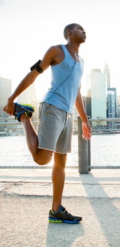 jogger stretching on pier
